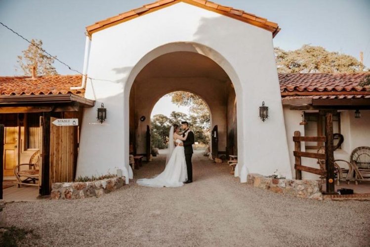 Couple in arch from stables